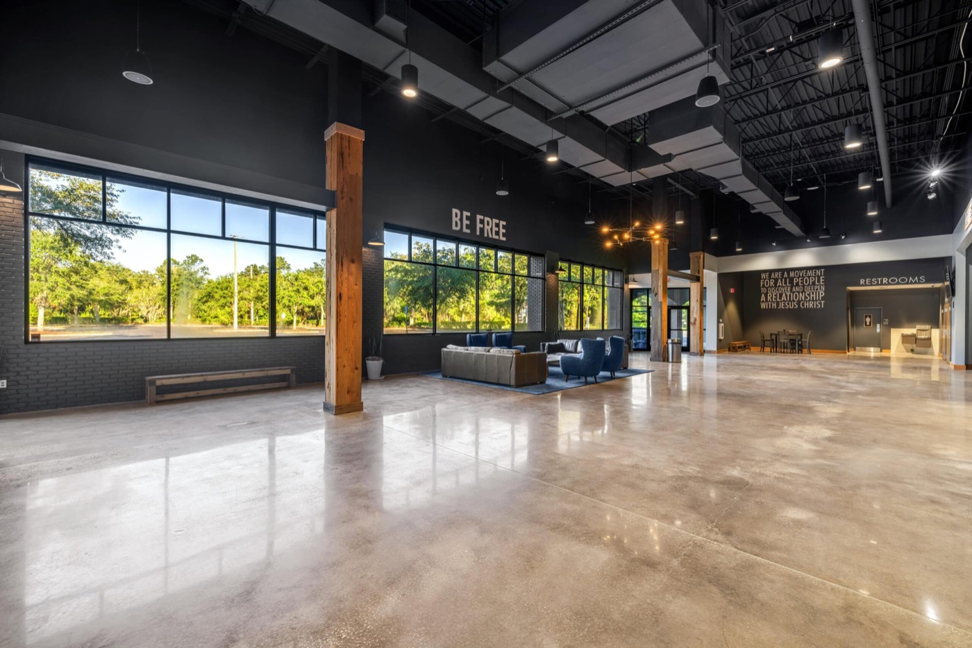 The same lobby after renovation — bright, welcoming gathering space